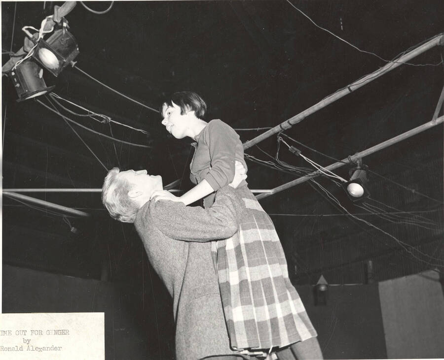 Clifford Cook holds up Harriet Hosack, as Ginger Carol, in Idaho drama's production of "Time Out for Ginger."