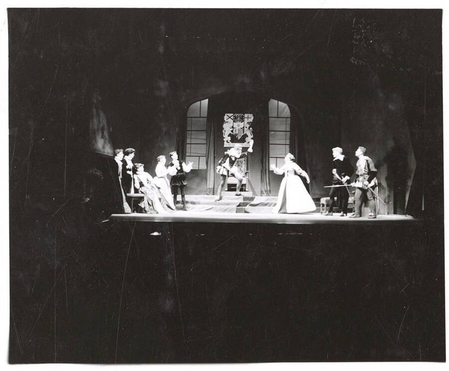 Students pictured: Dollie Fox, Glenmar Hoke, Maizie Collett, Nancy Leek, Dave Cummins, Gary Leaverton, Janet Biker, Clifford Cook, Grant Golette. Idaho drama students perform a group scene during the production of "Mary of Scotland."