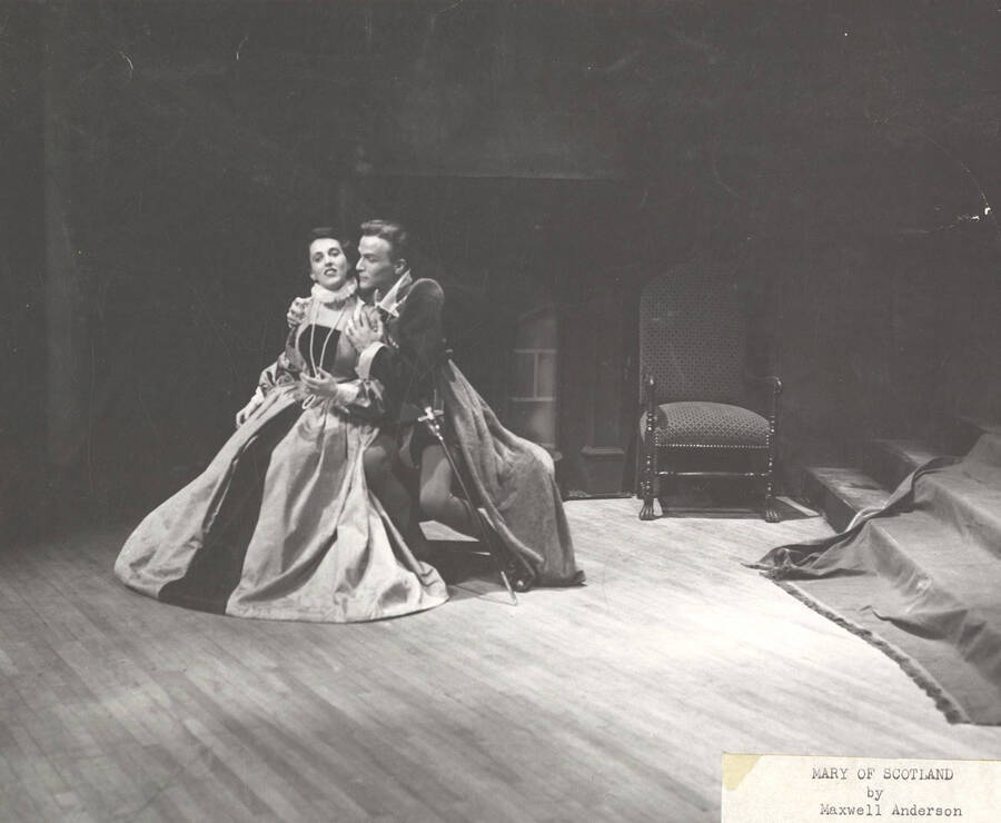 J. Madison holds Janet Biker from behind in Idaho drama's production of "Mary of Scotland."