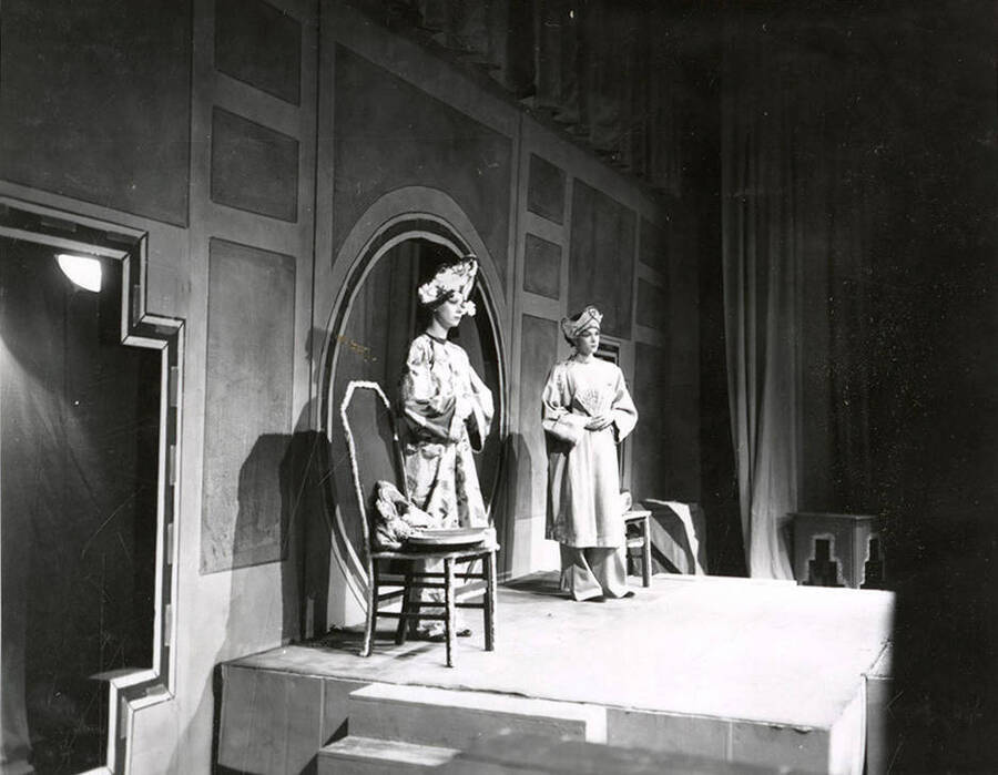 Connie Brookins and Glenmar Hoke performing together on stage during a drama production of 'Lute Song'.