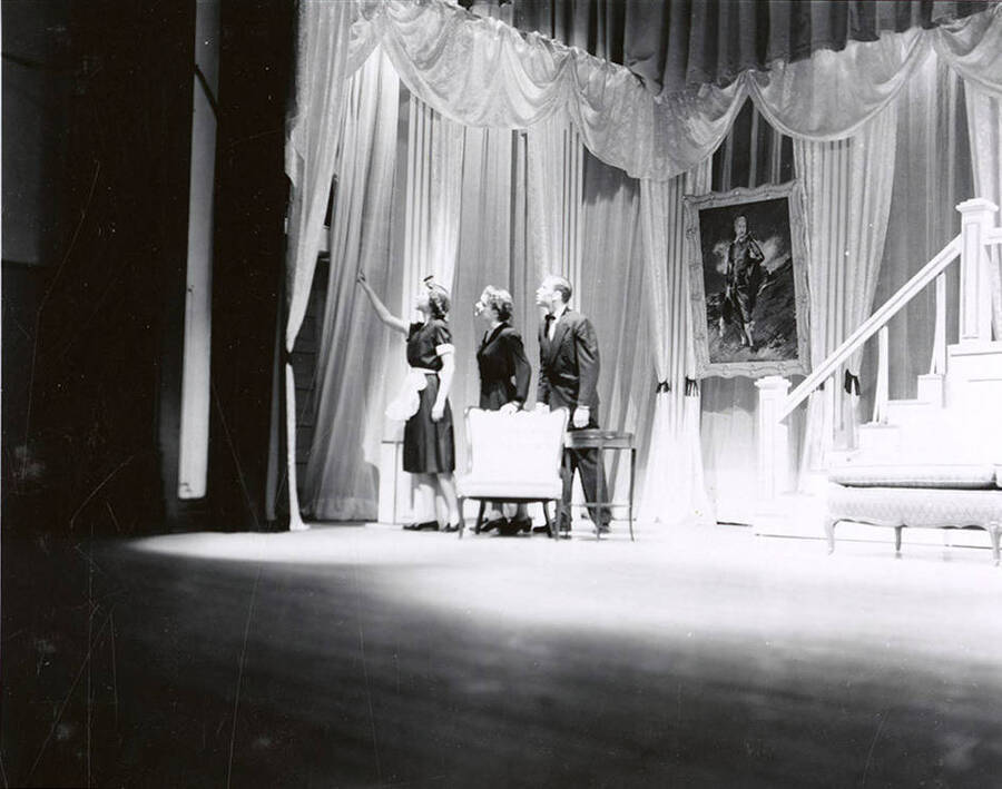 Karen Lee Kraus, Arlene Brown, Hans Gotsh perform a group scene together on stage during a drama production of 'Mrs. McThing'.