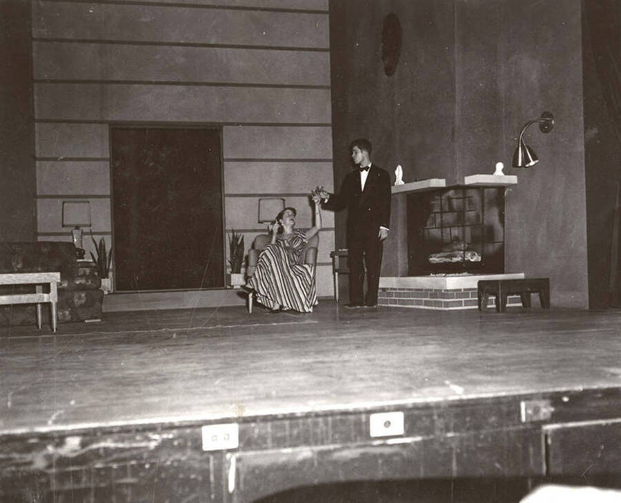 Sharon Henderson and Gary Leaverton perform together on stage during a drama production of 'Blithe Spirit'.