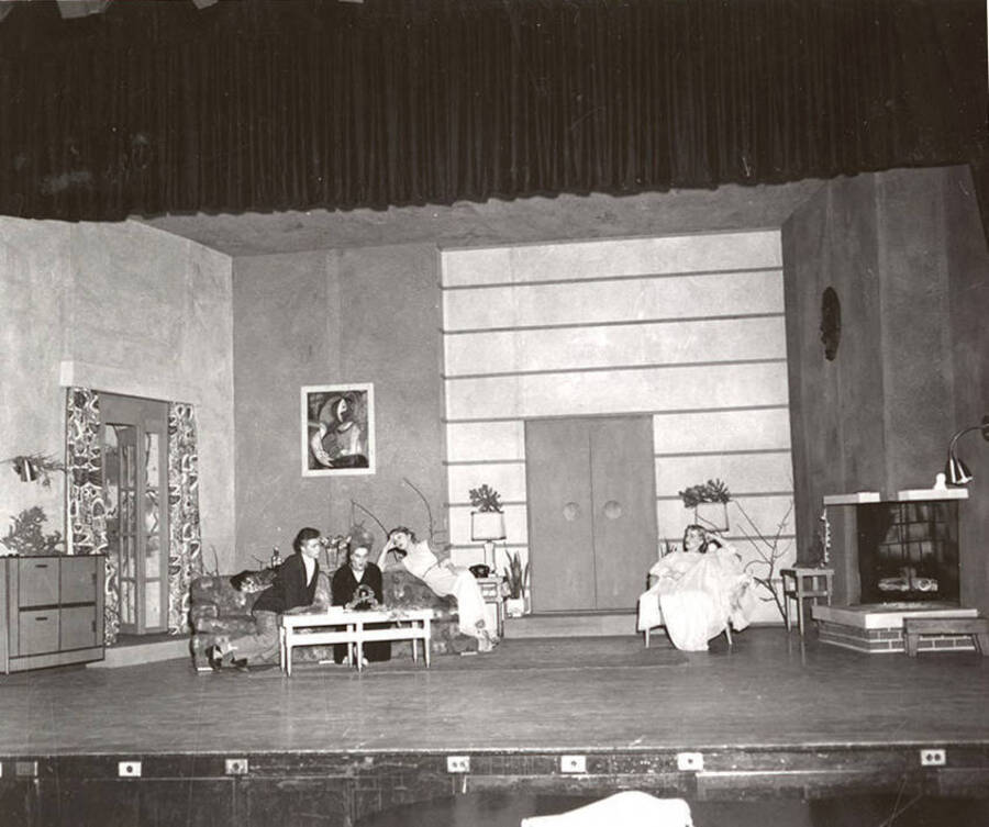 Gary Leaverton, Shirley Lent, Sharon Henderson, Lea Jensen perform a group scene during a drama production of 'Blithe Spirit'.
