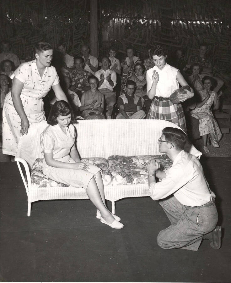 Shirley Lent, Toni Botsford, Connie Brookins and Andy Tozier perform together on stage during a drama production of 'Charity Begins'.