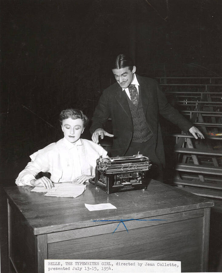 Cast members performing a drama production of 'The Typewriter Girl'. Directed by Jean Collette. Caption reads 'BELLE, THE TYPEWRITER GIRL, directed by Jean Collette, presented July 13/15, 1954.'