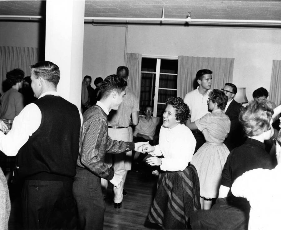 A couple dances at the Ethel Steel House Nickel Hop, held in Forney Hall. Other dancers can be seen in the background.