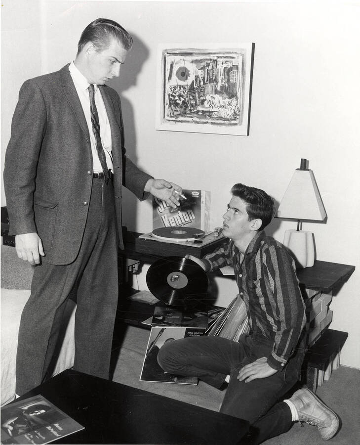 Gerald Goodenough as Mark McPherson and Travers Huff as Danny. One man kneeling on his knees and the other looking down at him.