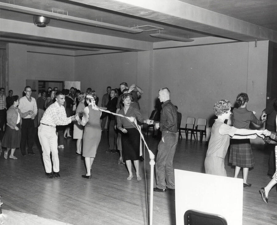 Students dance in the ballroom at the open house after the completion of a third addition to the Student Union Building.