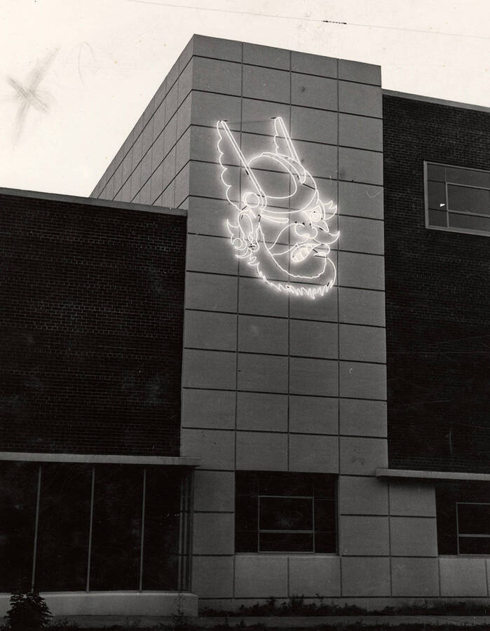 A large neon Vandal symbol is displayed on the on the Deakin Street side of the Student Union Building.