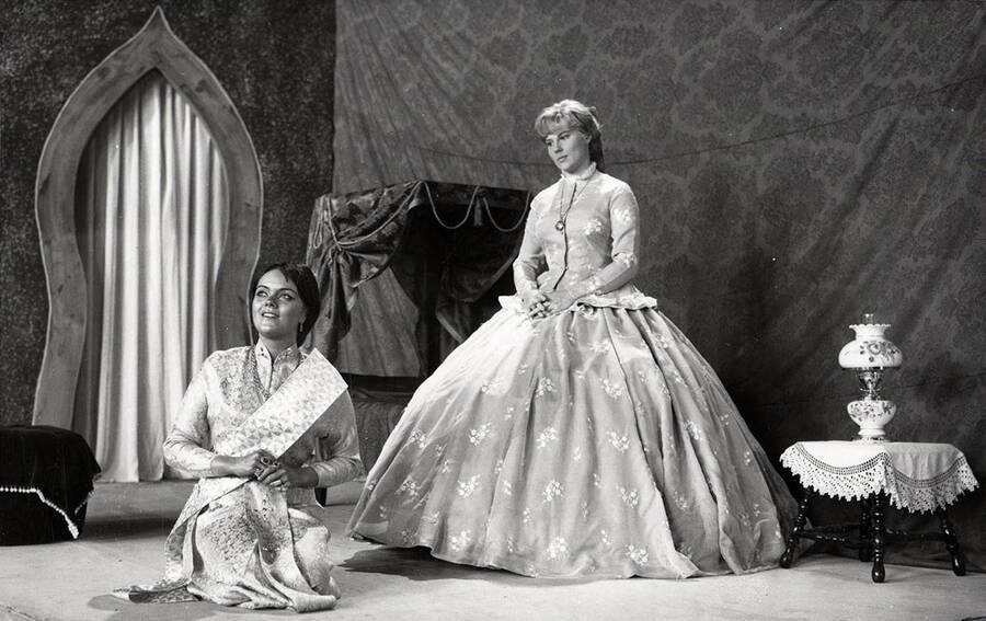 Dorothy Neuer and Roberta Cook acting in the University of Idaho drama production of 'The King and I.' This production was directed by Edmund Chavez.