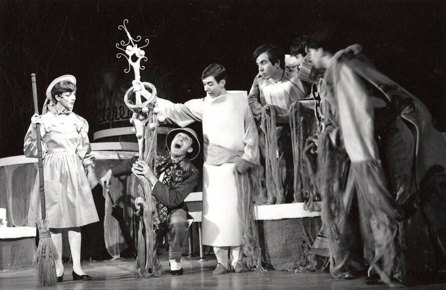Group scene during the University of Idaho drama production of 'The Man in the Moon.' Pictured from left to right are Eloise Wilson, Dick Douglass, Brent Wagner, Val Malkenhuhr, James Madden, and Carla Maryott.