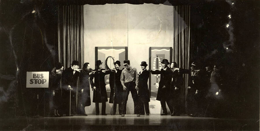 Scene during the University of Idaho drama production of 'Hairy Ape.' Cast members can be seen dressed in black and standing on stage.