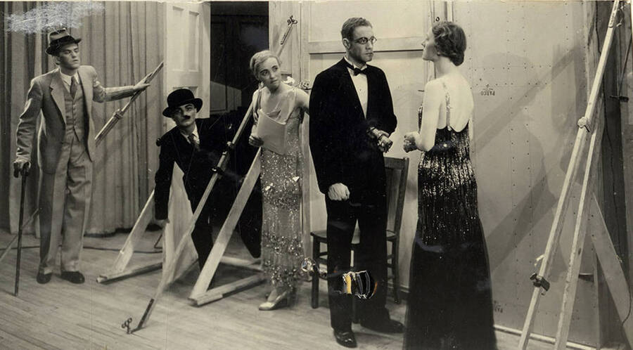 Scene from the University of Idaho drama production of 'Torchbearers.' In this scene, Mrs. Pampinelli is saying 'The show positively, absolutely must go on'. Members of the cast include Catherine Brandt as Mrs. J. Duro Pampinelli, Grace Eldridge as Mrs. Nelly Fell, Marthalene Tanner as Mrs. Paula Ritter and Leland Cannon as Fred Ritter.