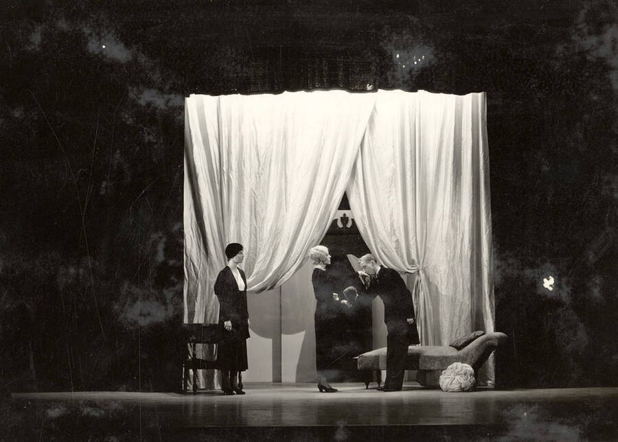 Scene from the University of Idaho drama production of 'The Living Corpse.' Cast members include Fred C. Blanchard as Fedya, Ethlyn O'Neal as Lisa, Clayne Robison as Victor, Alberta Bergh Utt as Masha, Raphael Gibbs as Prince Sergius, Erma Lewis as Anna Pavlovna, Casady Taylor as Petrovitch, Earl Bopp as Artimiev, and Joe Paquet as Petushkov.