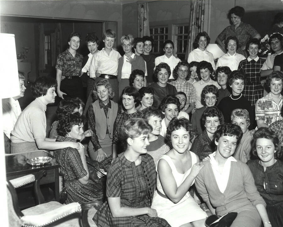 Part of a group photograph of Delta Gamma women preparing for a formal portrait after Squeal Day.