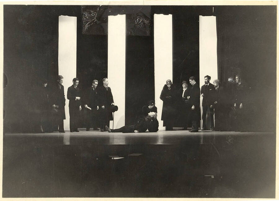 Scene from the University of Idaho drama production of 'The Living Corpse.' This is the scene in which 'the living corpse is no more.' Cast members include Fred C. Blanchard as Fedya, Ethlyn O'Neal as Lisa, Clayne Robison as Victor, Alberta Bergh Utt as Masha, Raphael Gibbs as Prince Sergius, Erma Lewis as Anna Pavlovna, Casady Taylor as Petrovitch, Earl Bopp as Artimiev, and Joe Paquet as Petushkov.