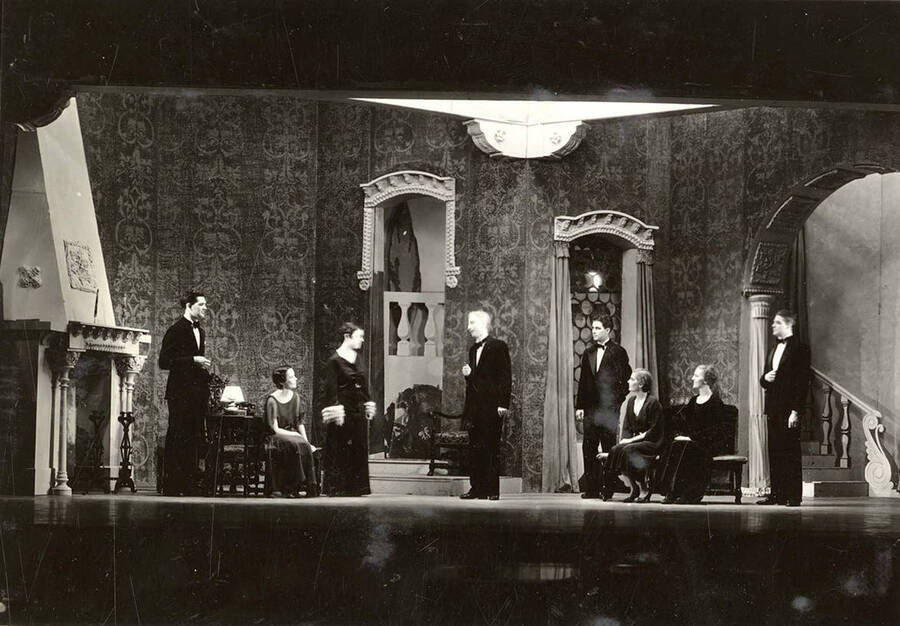 Scene from the University of Idaho drama production of 'Death Takes a Holiday.' Members of the cast include Lionel Campbell as Prince Sirki, Bertha Moore as Grazia, Clayne Robison as Duke Lambert, Winfred Janssen as Eric Fenton, Howard Altnow as Corrado, Raphael Gibbs as Baron Cesarea, and Casady Taylor as Major Whitred.