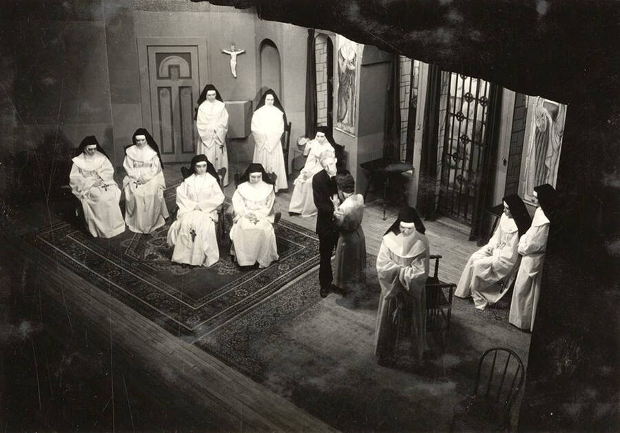 Group scene from the University of Idaho drama production of 'The Cradle Song.' Members of the cast include Bertha Moore as Sister Joanna of the Cross, Margaret Moulton as Teresa, Kathryn Hart Conger, Grace Eldridge, Lucille Moore, Betty Brown, Dorothy Menzies, Naomi Randall, Elinor Jacobs, Alberta Bergh, Elizabeth Loomis, and Lillian Sorenson.