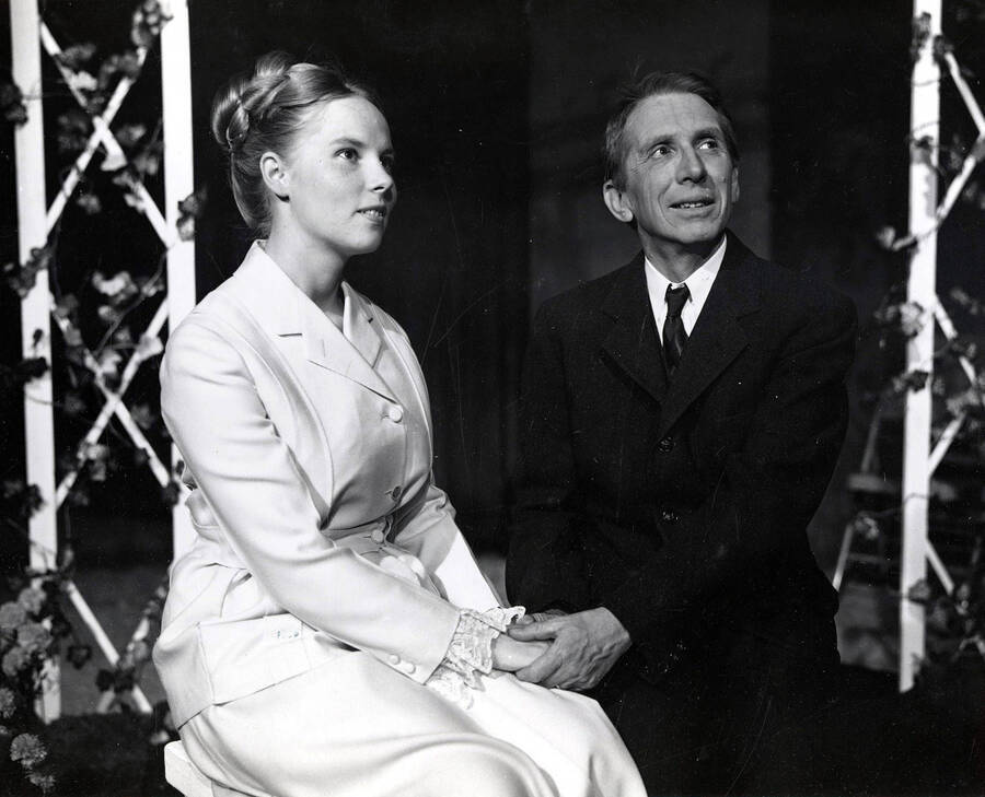 The University of Idaho drama production of 'Little Mary Sunshine.' Bill Byrd (right) can be seen sitting with a woman and holding her hands.