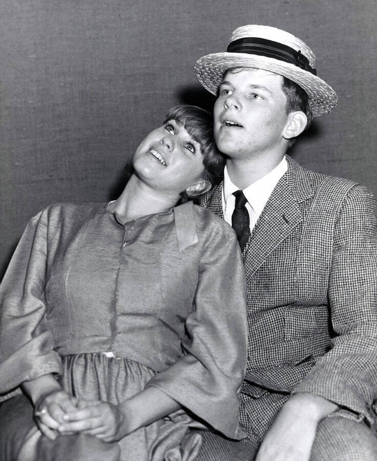 Scene during the University of Idaho drama production of 'Ah, Wilderness.' Nancy Kandal and Bob Van Wagoner can be seen dressed in costume and sitting together.
