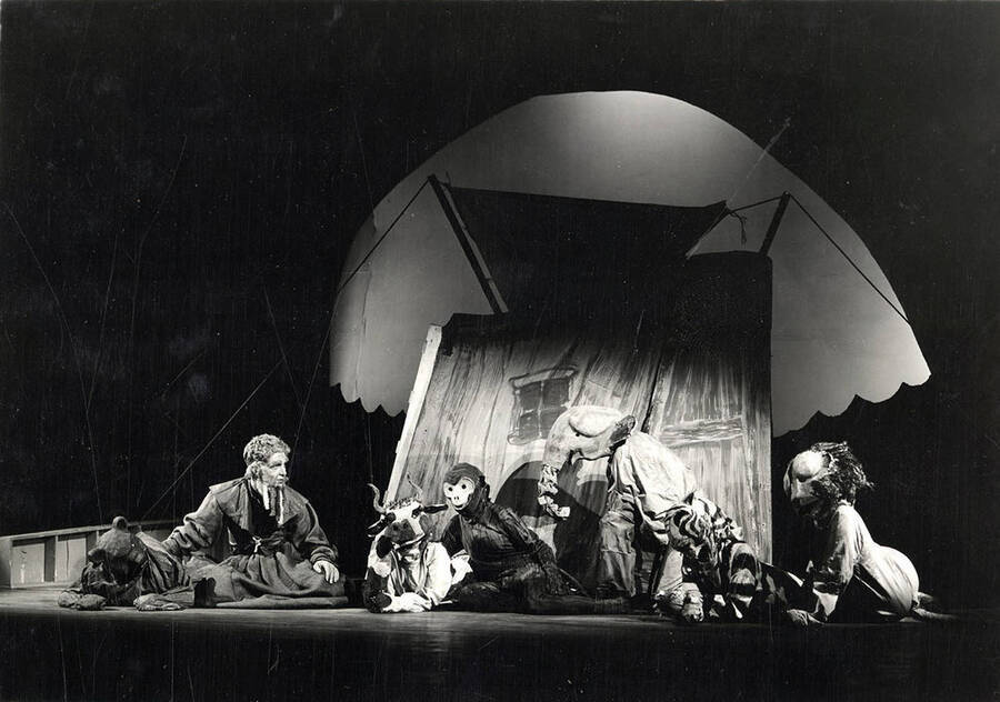 Scene from the University of Idaho drama production of 'Noah.' This production was directed by Jean Collette. The actors can be seen sitting on stage, dressed in their costumes.