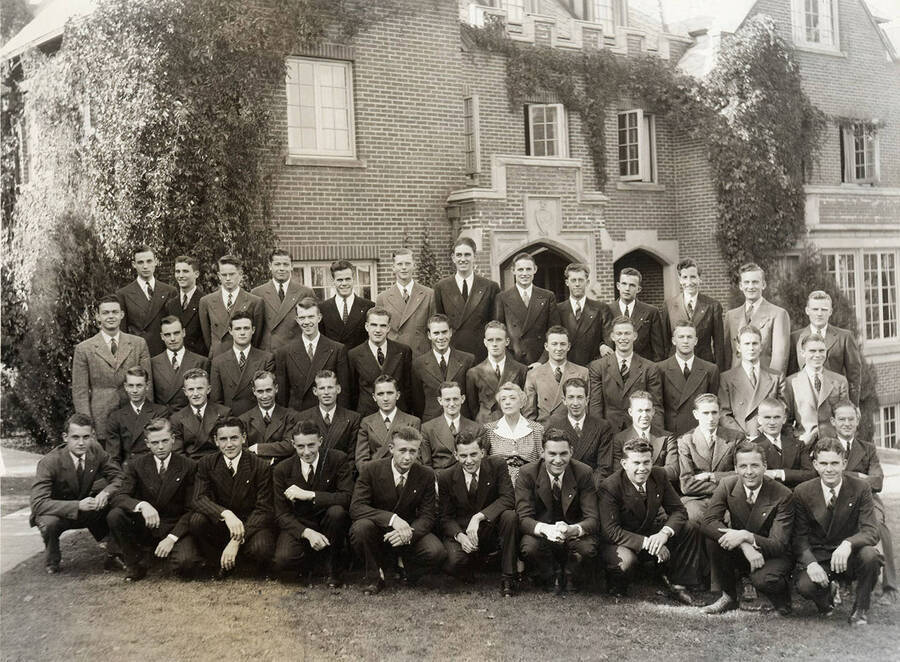 Group picture outside the Beta Theta Phi house, located on the northwest corner of Idaho and Elm Streets.
