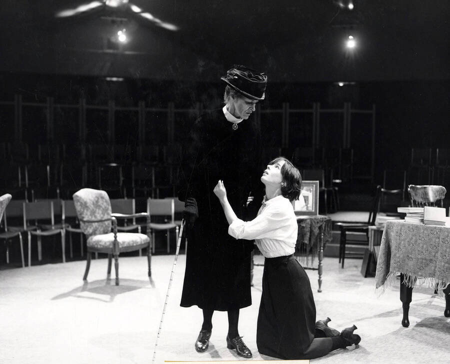 Scene from the University of Idaho drama production of 'Anastasia.' This production was directed by Robert Thompson. One woman can be seen kneeling and holding onto another woman.