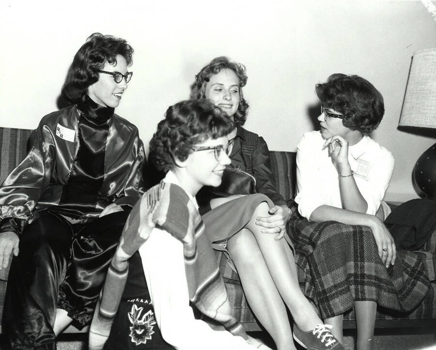 Four women sit and talk during Gamma Phi Beta's rush week.