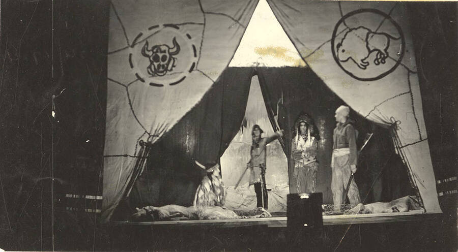 The University of Idaho drama production of 'Wayfaring Men,' written by Talbot Jennings and directed by John H. Chushman.Individuals identified from left to right: Dawn Mist, The Raven, Last Star and Francois Payette in the Lodge of Last Star, chief of the Cree.