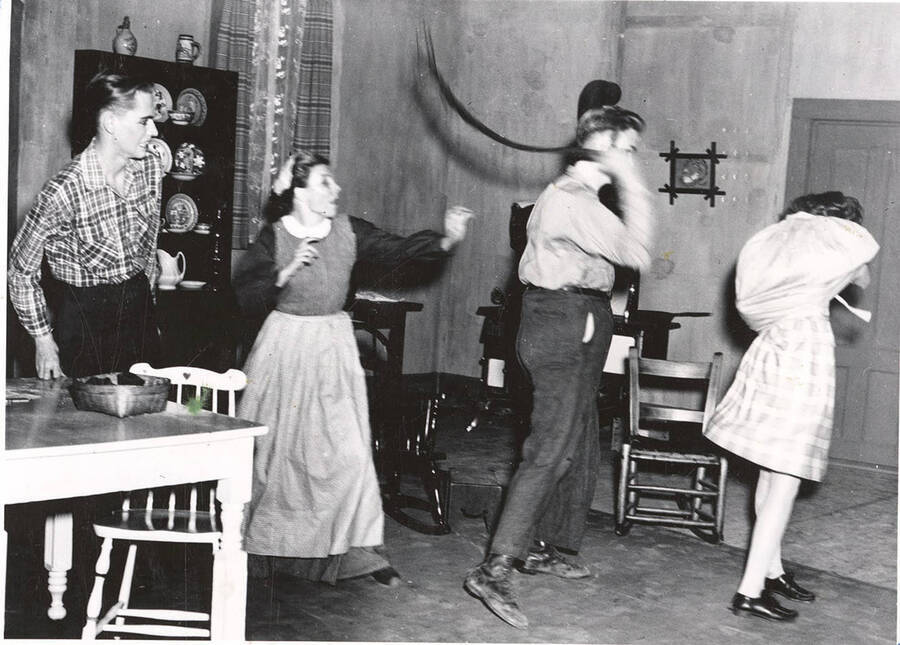 The University of Idaho drama production of 'Papa Is All.' Individuals identified from left to right: Edward Dalva as Jake, Grace Lillard as Mama, William Davidson as Papa, and Marion Wilson as Emma.