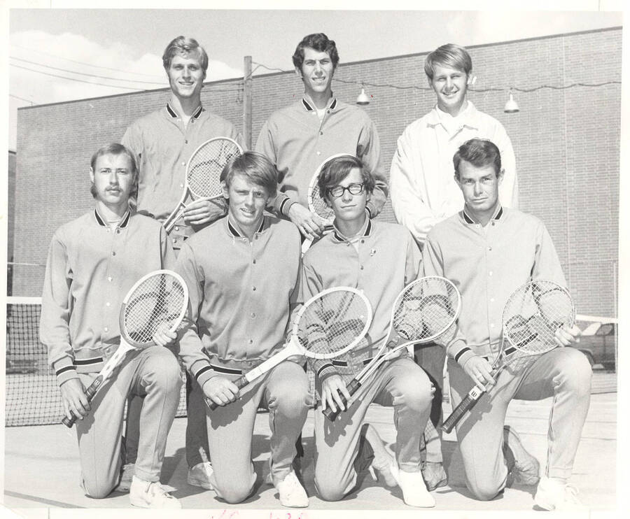 A 1970's men's Tennis team poses for its team photograph.