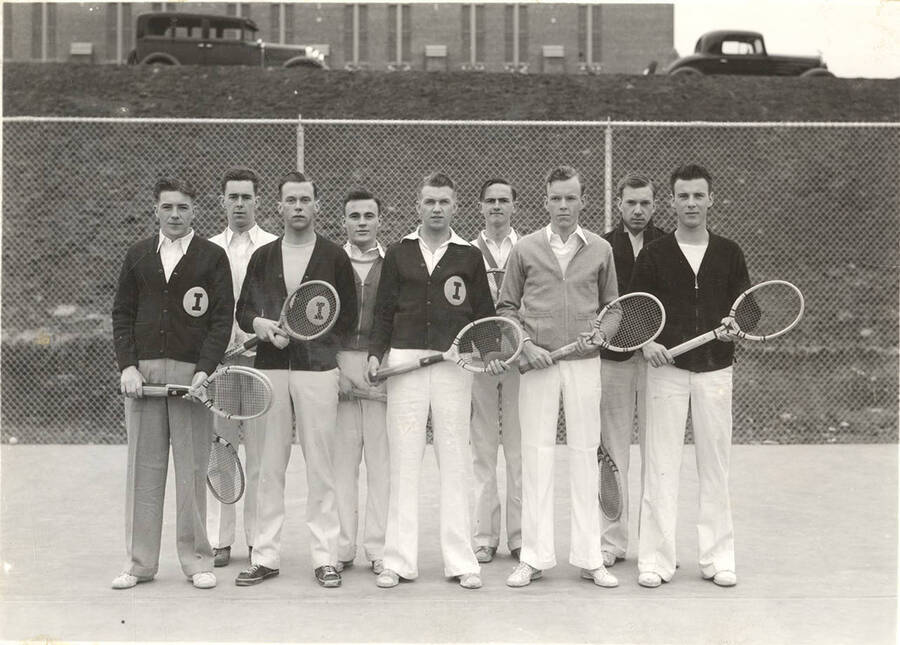 The 1935 Idaho varsity Tennis team poses on-court for a team photograph.