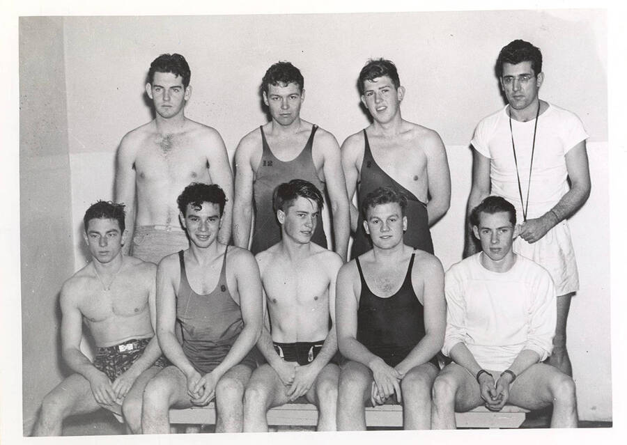 The 1942 Idaho men's Swimming team poses in the Memorial Gym natatorium for a group photograph.
