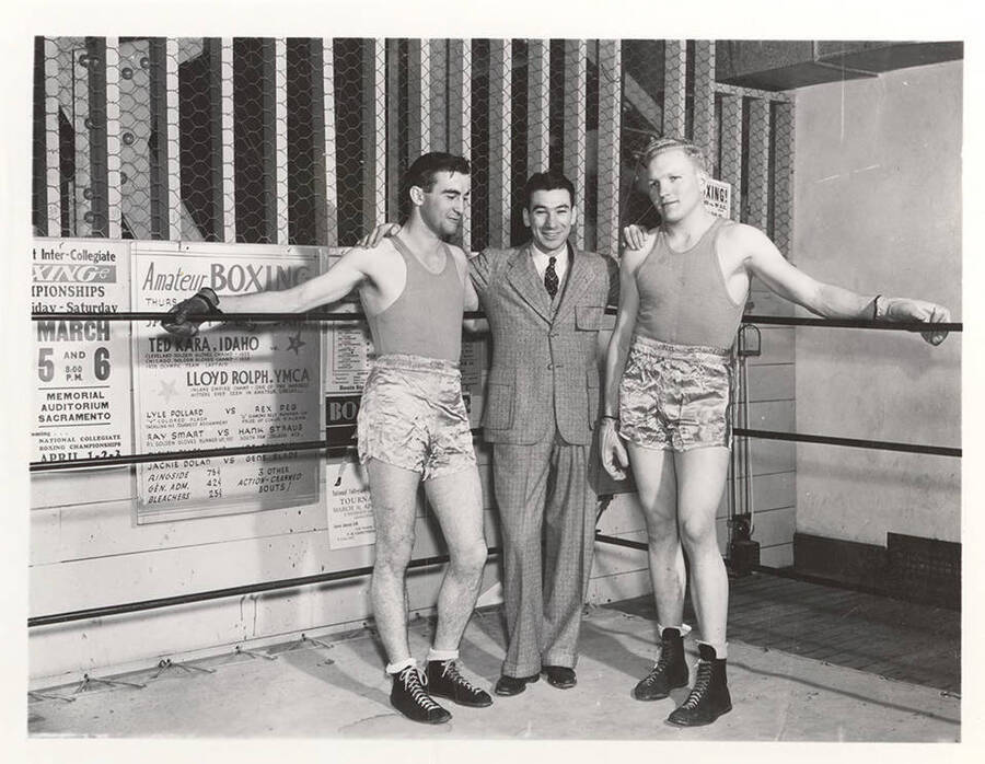 Idaho boxers Joe Fallini and Carl Killian pose beside the renowned Idaho Boxing coach, Louis August. L-r: Joe Fallini, Coach Louis August, Carl Killian.