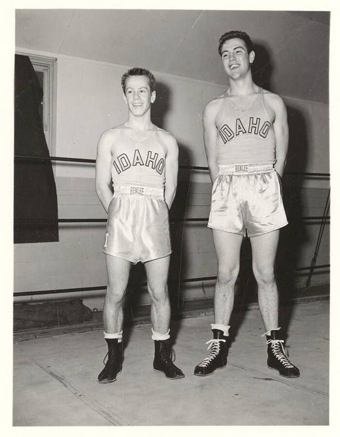 Idaho boxers Jack Gray and Jim Dreiver smile and pose for individual team photographs.