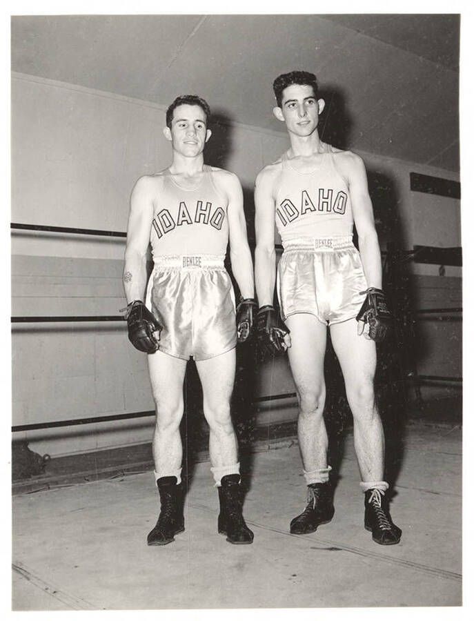 Idaho boxers Frank Echevarria and John Echevarria smile for a team photograph.