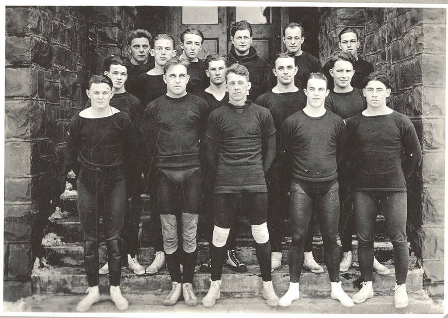 The 1925 Idaho varsity Wrestling squad poses on the steps of the Art and Architecture Building.