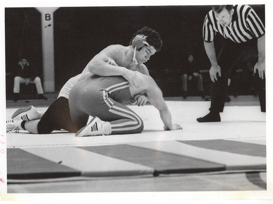 An unknown Idaho wrestler gets back position on an unknown opponent.