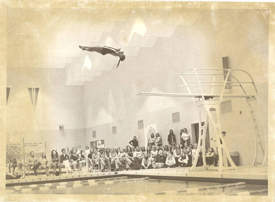 An unidentified women's diver performs at the AIAW national championships.