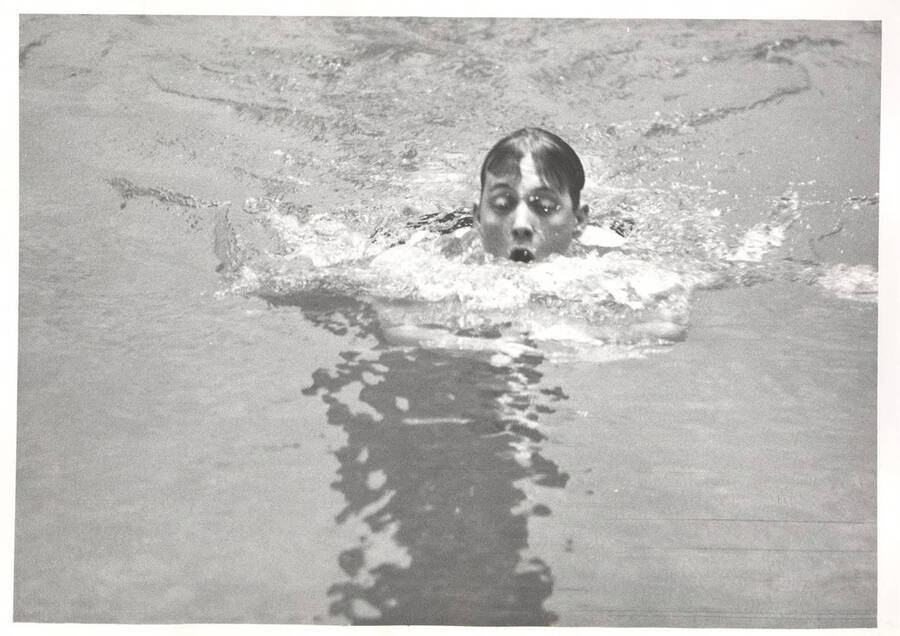 An unidentified Idaho men's swimmer comes up for air during a trial.