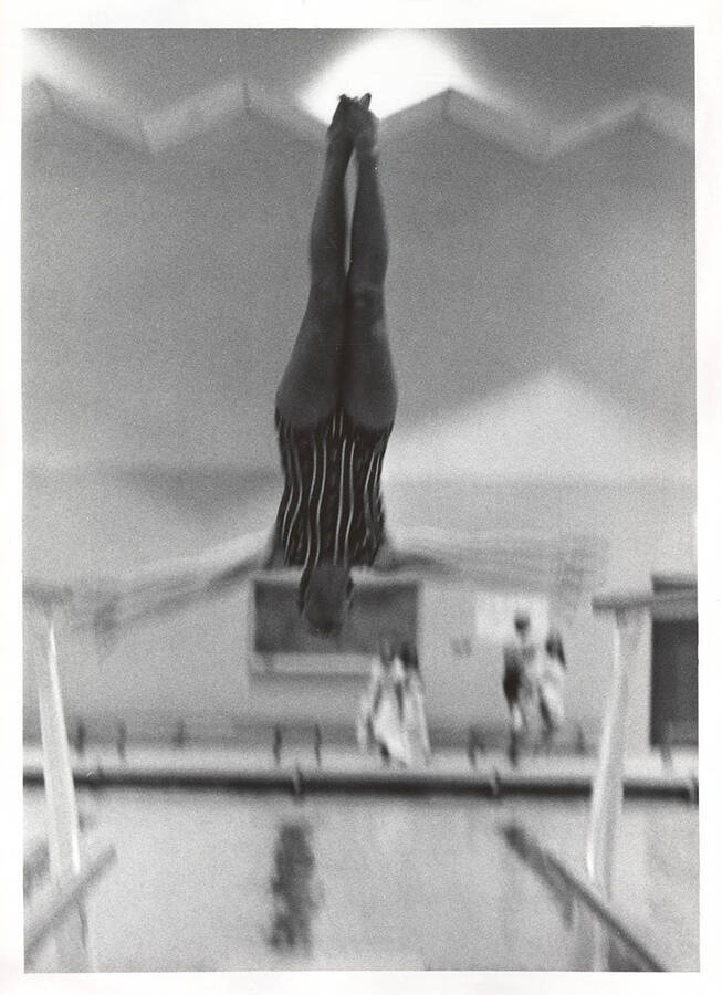 An unidentified women's diver practices in the Swim Center.