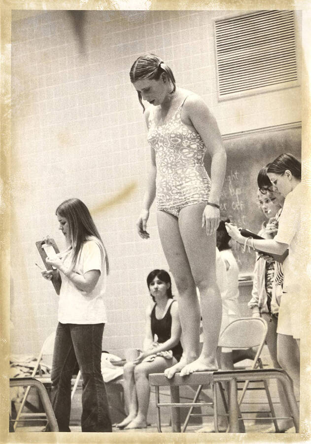 An unnamed Idaho women's swimmer asseses her gameplan before leaping off the starting block.