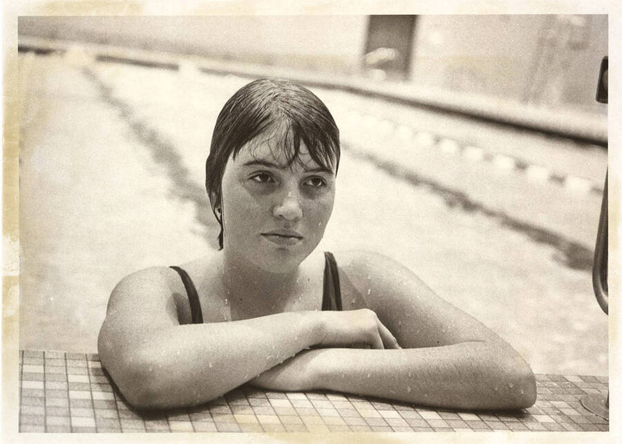 An unknown Idaho women's swimmer takes a breather after an event.