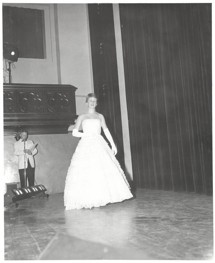 Queen contestant Sally Newland of University of Idaho walks across the Administration Auditorium during the 37th National Convention of the Intercollegiate Knights, a national honorary service organization.