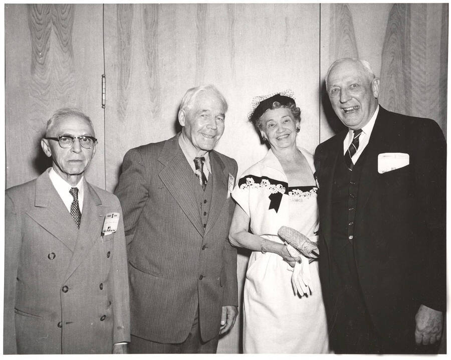 Members of the class of 1904 pose for a photograph at their 50th reunion. Individuals identified from left to right: Benjamin W. Oppenheim, James L. Adkison, Mrs. Jeome J. Day, Earl David.