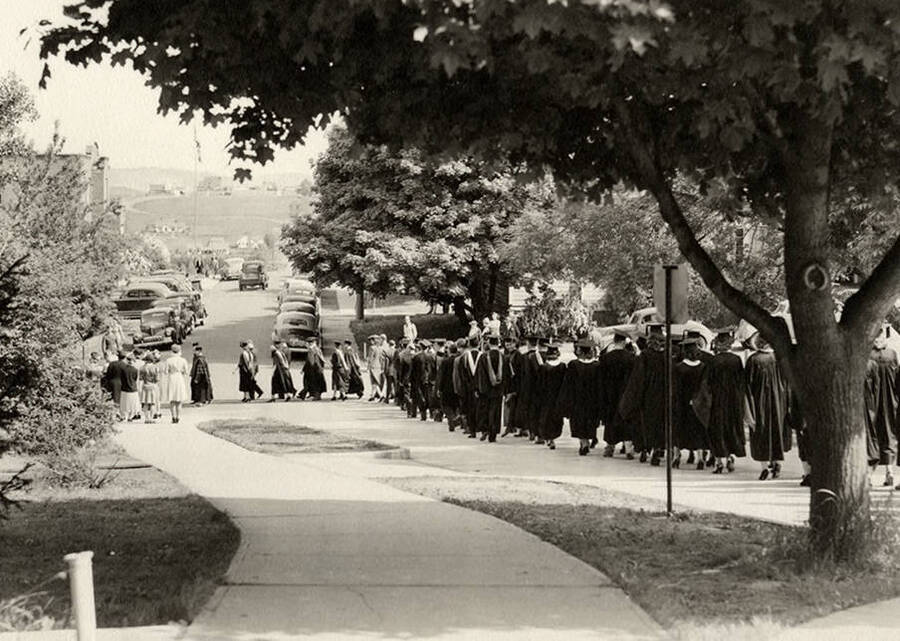 Academic procession passing through the University of Idaho campus during the 1945 Commencement ceremony.