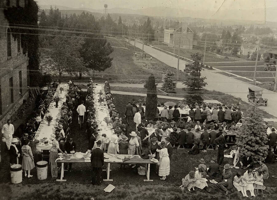 University dinner held outside Ridenbaugh Hall following the 1922 Commencement ceremony.