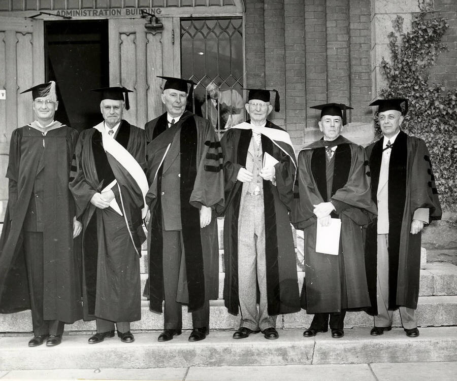 University of Idaho President Jesse Buchanan, Harry W. Morrison, Stanly Easton, James W. Girard, Dean Iddings and Governor C.A. Robins stand together on the Administration Building steps for the 1950 Commencement.
