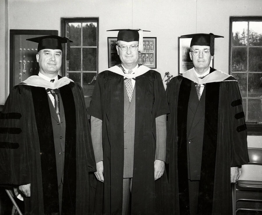 David Roy Shoults, University of Idaho President Jesse Buchanan and James B. Hays dressed in caps and gowns for the 1953 Commencement ceremony.