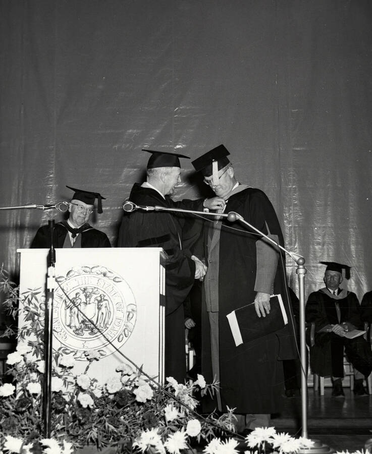 Carol Howe Foster and University of Idaho President Jesse Buchanan during the 1953 Commencement ceremony.